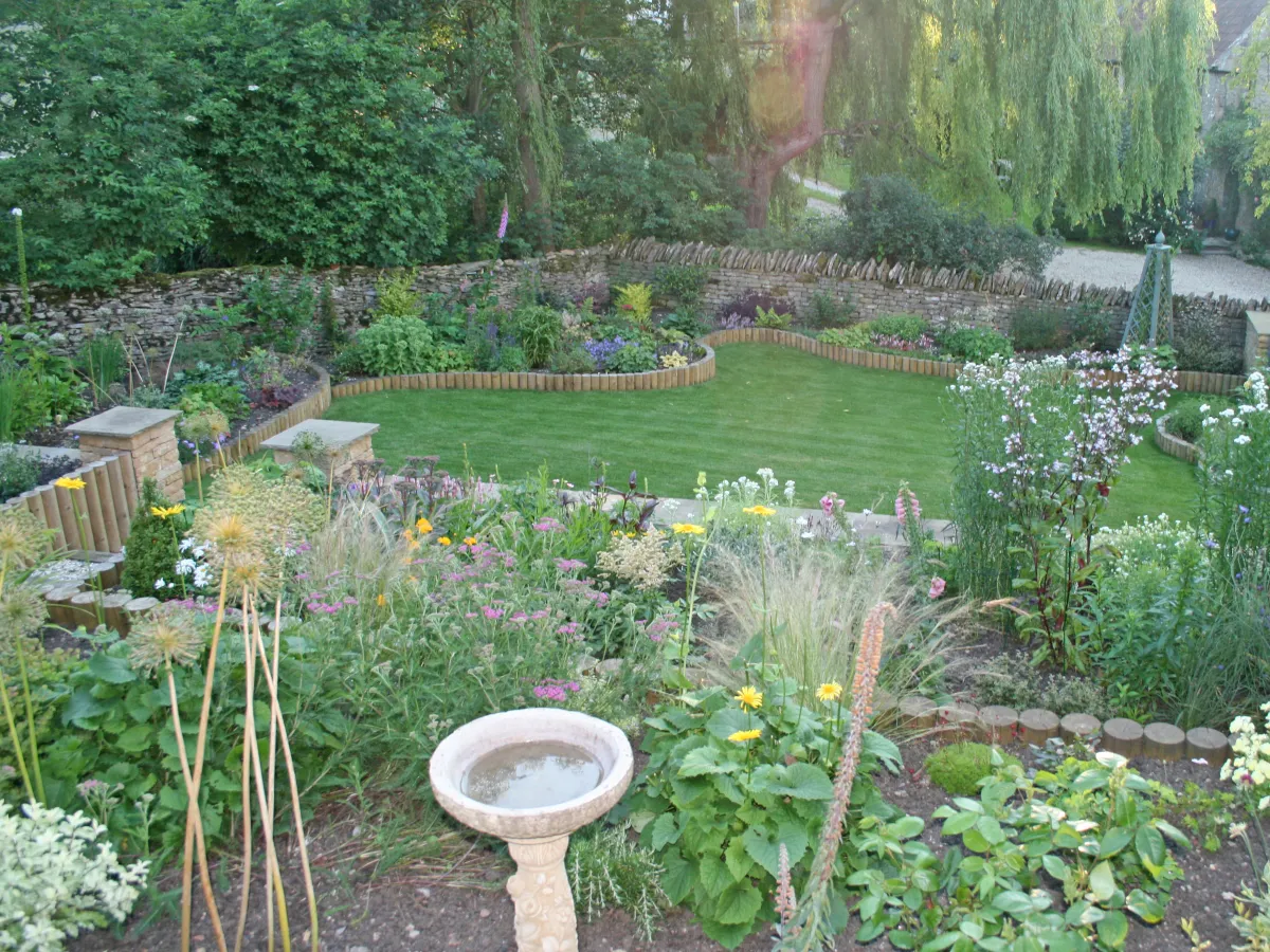 The main lawn and flowers beds in the arts and crafts garden